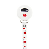 Red lips and black beret design on white button pacifier clip